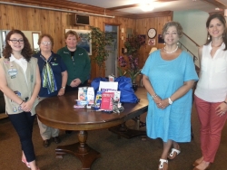 Pictured left to right: Girl Scout Cadette Teresa Buchner,Aleta Zornek, Lois Will, CMI Executive Director Robyn Krueger, and Andrea Gray.